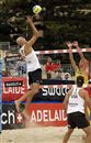 Phil Dalhausser (left) hits at the SWATCH net against Frenchman Andy Ces as American partner Todd Rogers watches
