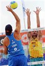 2007 SWATCH-FIVB World champion Todd Rogers (left) of the United States hits against 2005 SWATCH-FIVB World champion Fabio Magalhaes at the SWATCH net Saturday